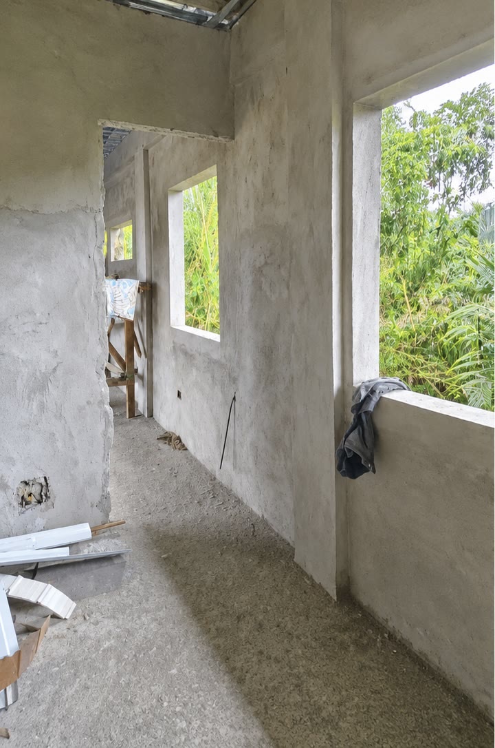An interior room rendered out, with the window opening framing the trees outside