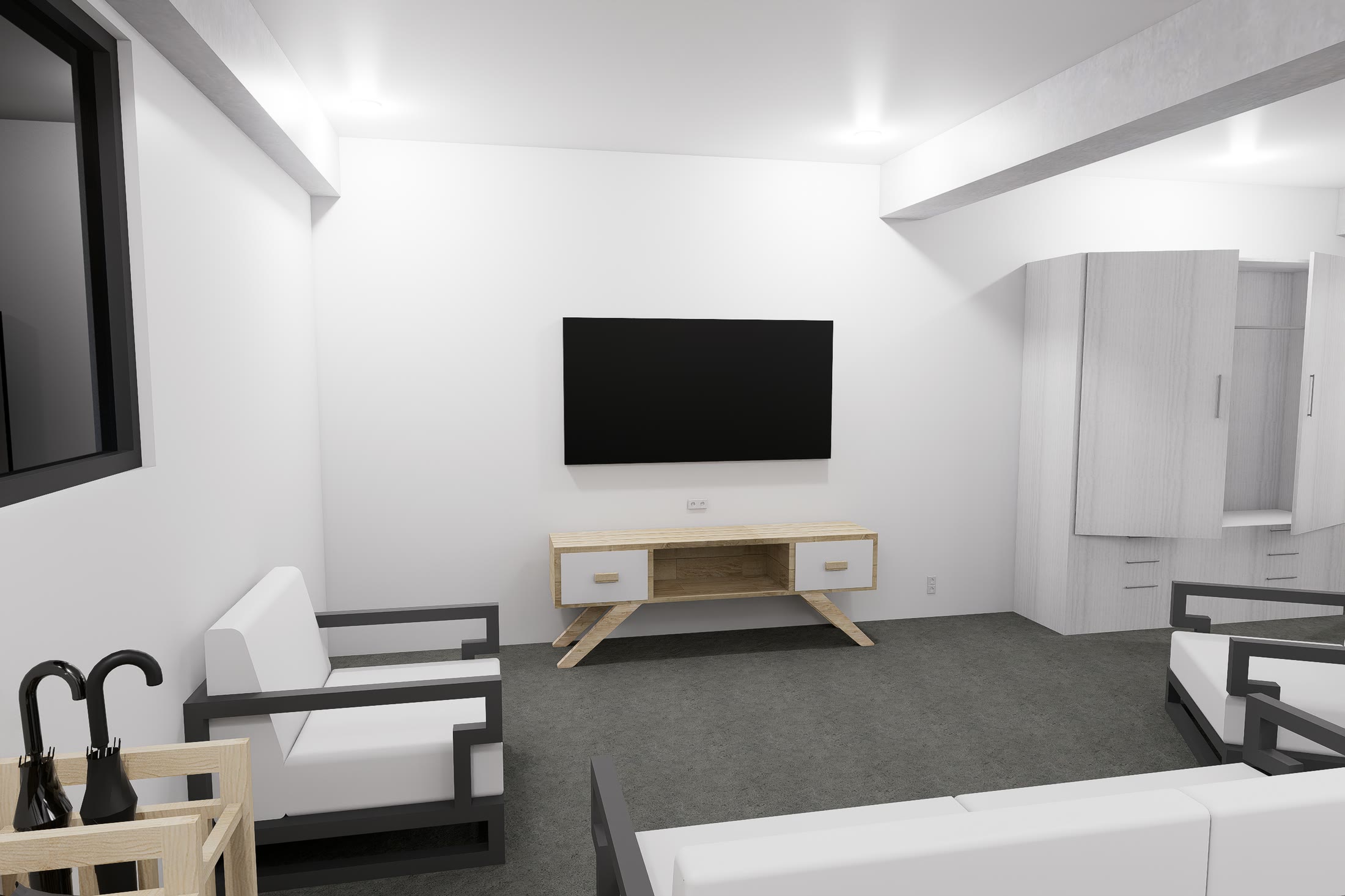 The ground floor suite, its living end with armchairs and console and the bed visible beyond