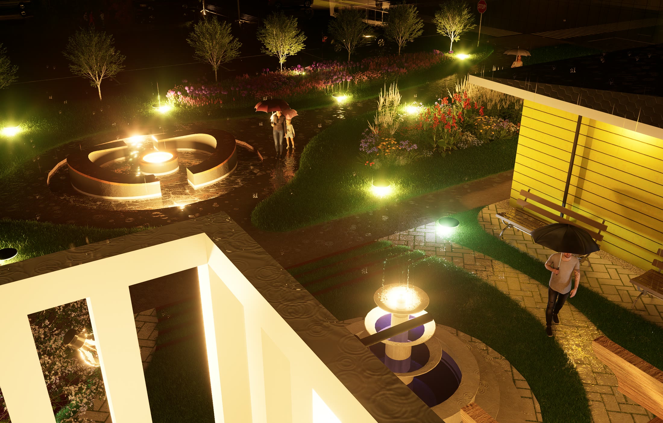 Aerial of the gardens at night, paths and planting picked out by ground lighting