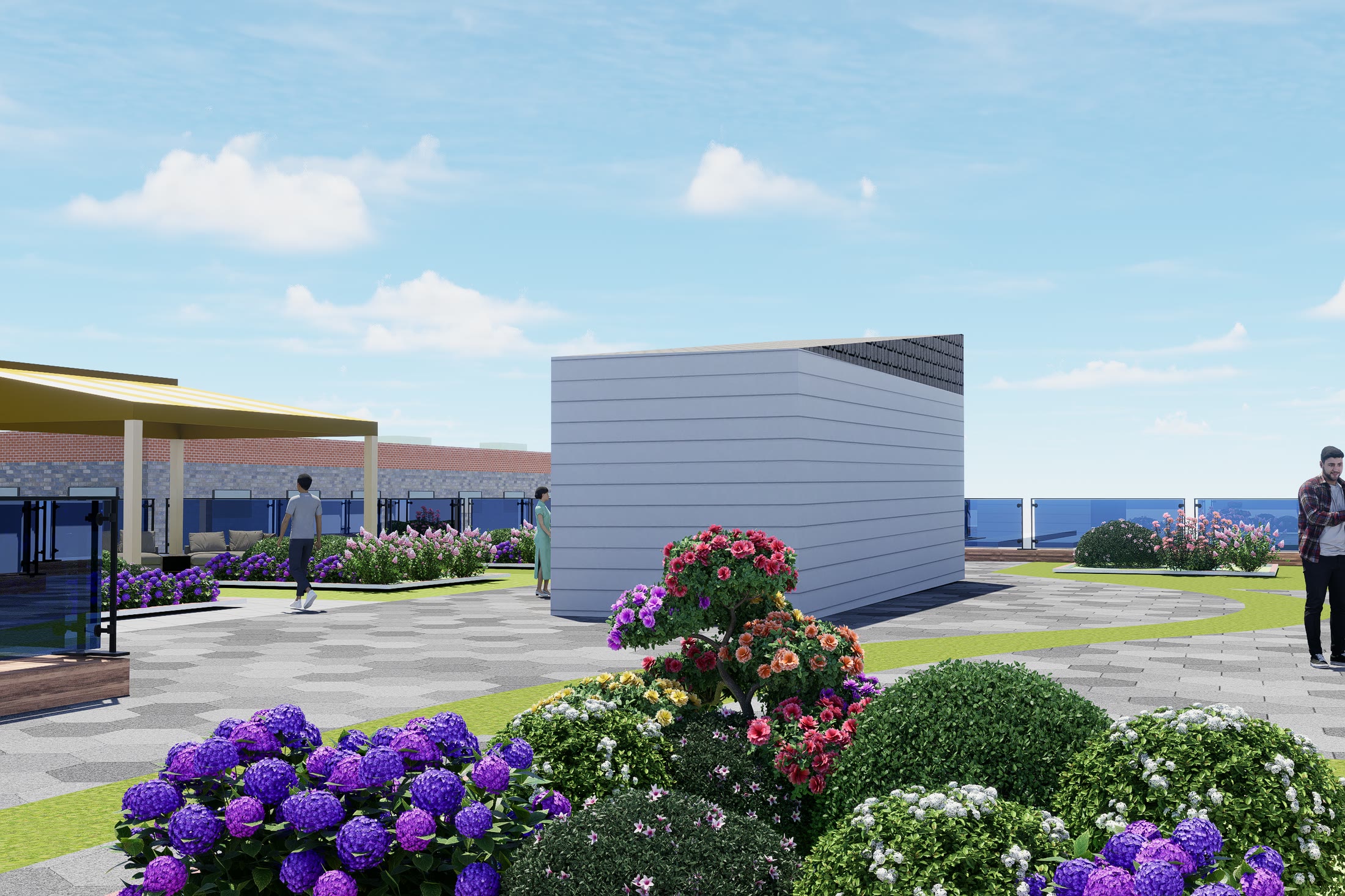The rooftop community garden in flower, with a pergola and the greenhouse structure behind