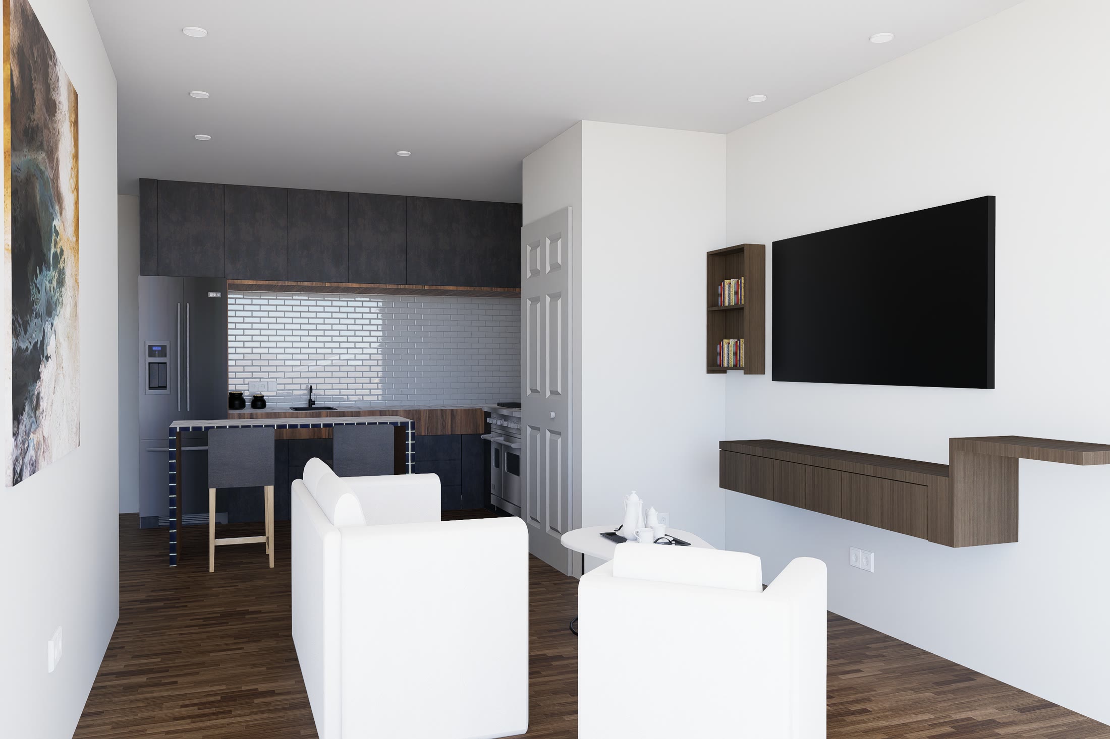 Living room of a one-bedroom unit with the kitchen behind it, a wall mounted television and a timber floor