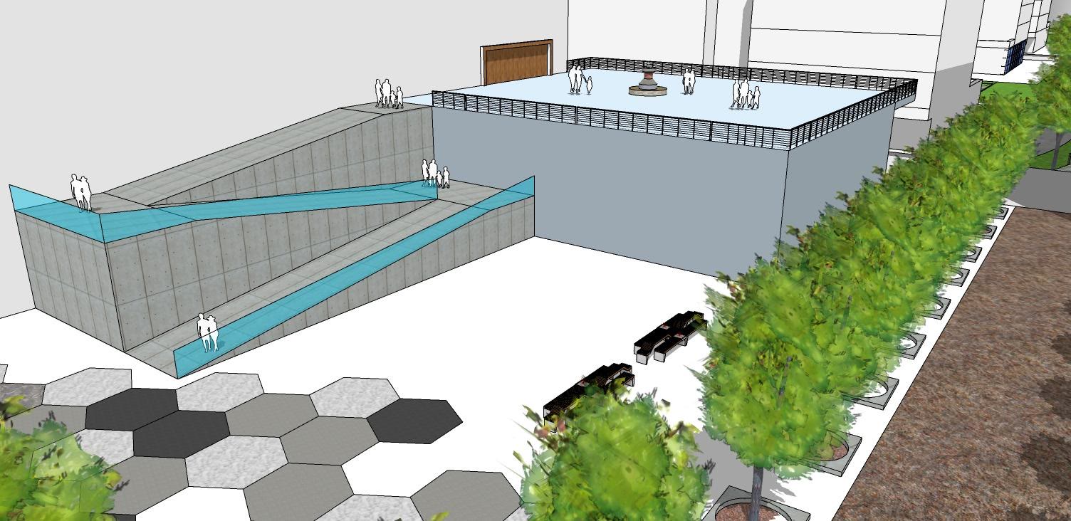 A shallow water basin edged with hexagonal paving and planting